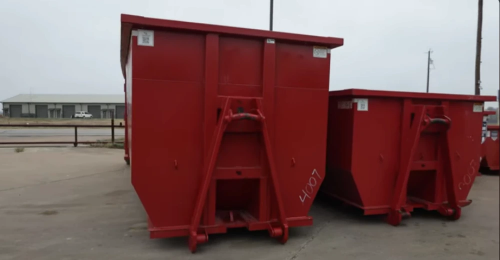 Roll-off dumpster staged in a driveway during a full home cleanout in Longview, TX